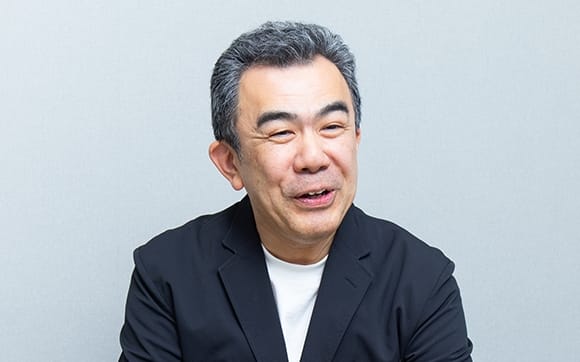 越塚 登 氏